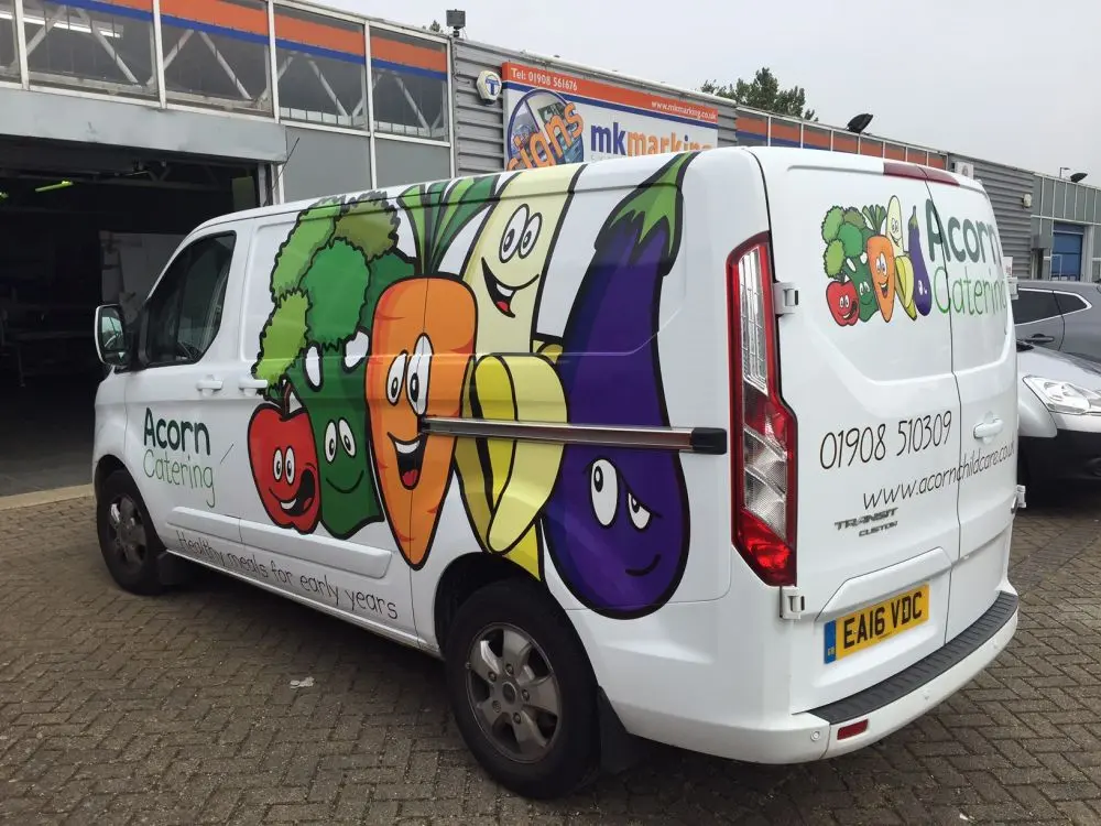 Van with sticker showing cartoon vegetables