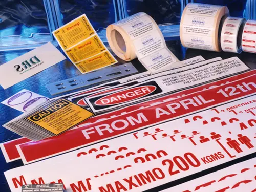 Collection of sticker on reels and singular, including warnings