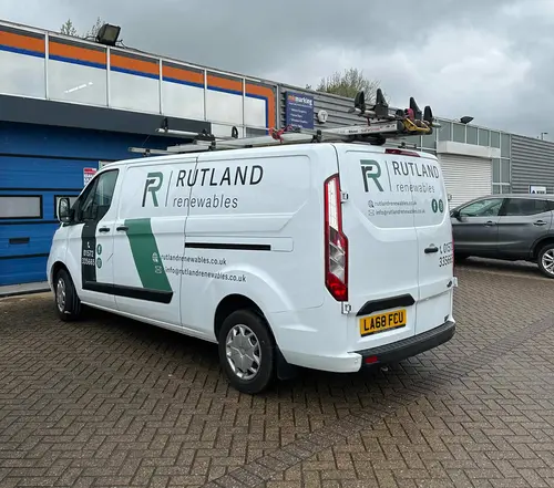 Silver van with graphics for an electrical company