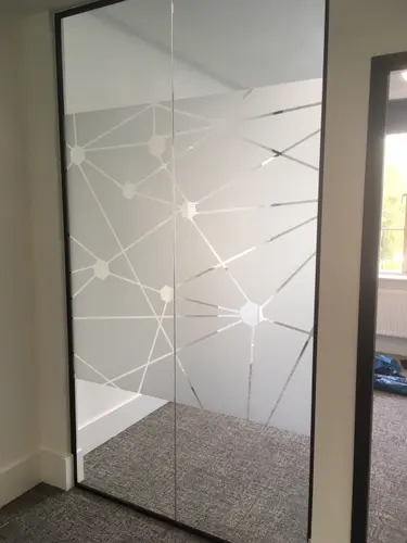 Patterned glass frosting for privacy in office