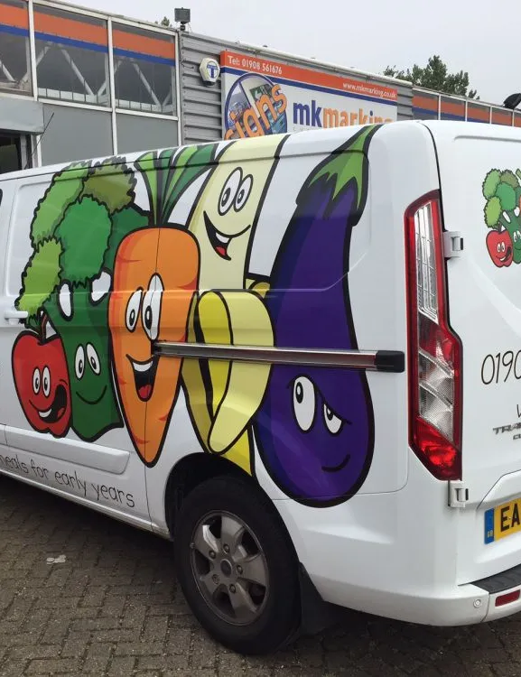 Van with sticker showing cartoon vegetables