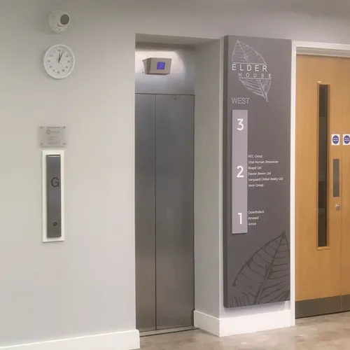 branded internal elevator sign