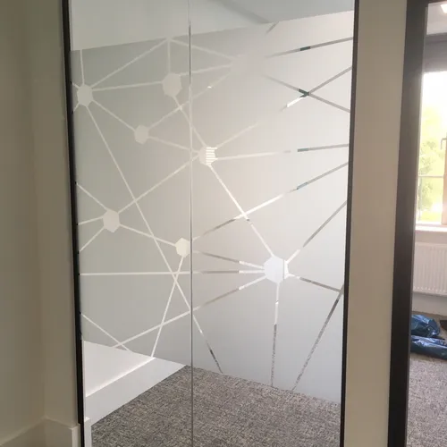 Patterned glass frosting for privacy in office